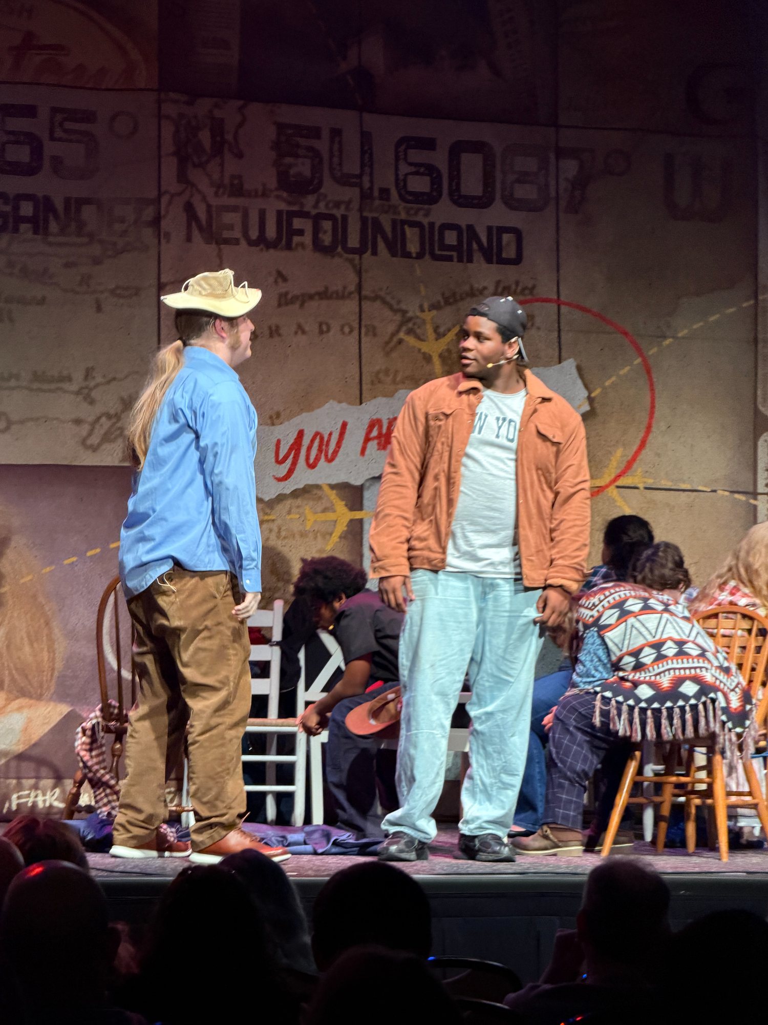 Two actors performing on a real stage