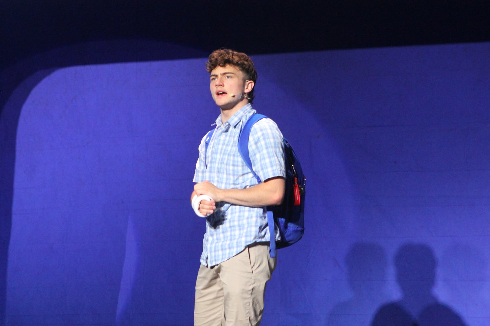 A teenage performer alone on stage under blue lights in NOVAPA's Teen Conservatory production of Dear Evan Hansen in Leesburg, Virginia